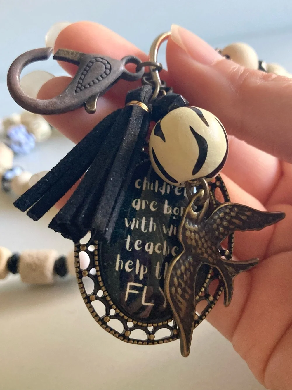 NWOT Plunder Black and Cream Beaded Pendant lanyard with Inspirational Charm